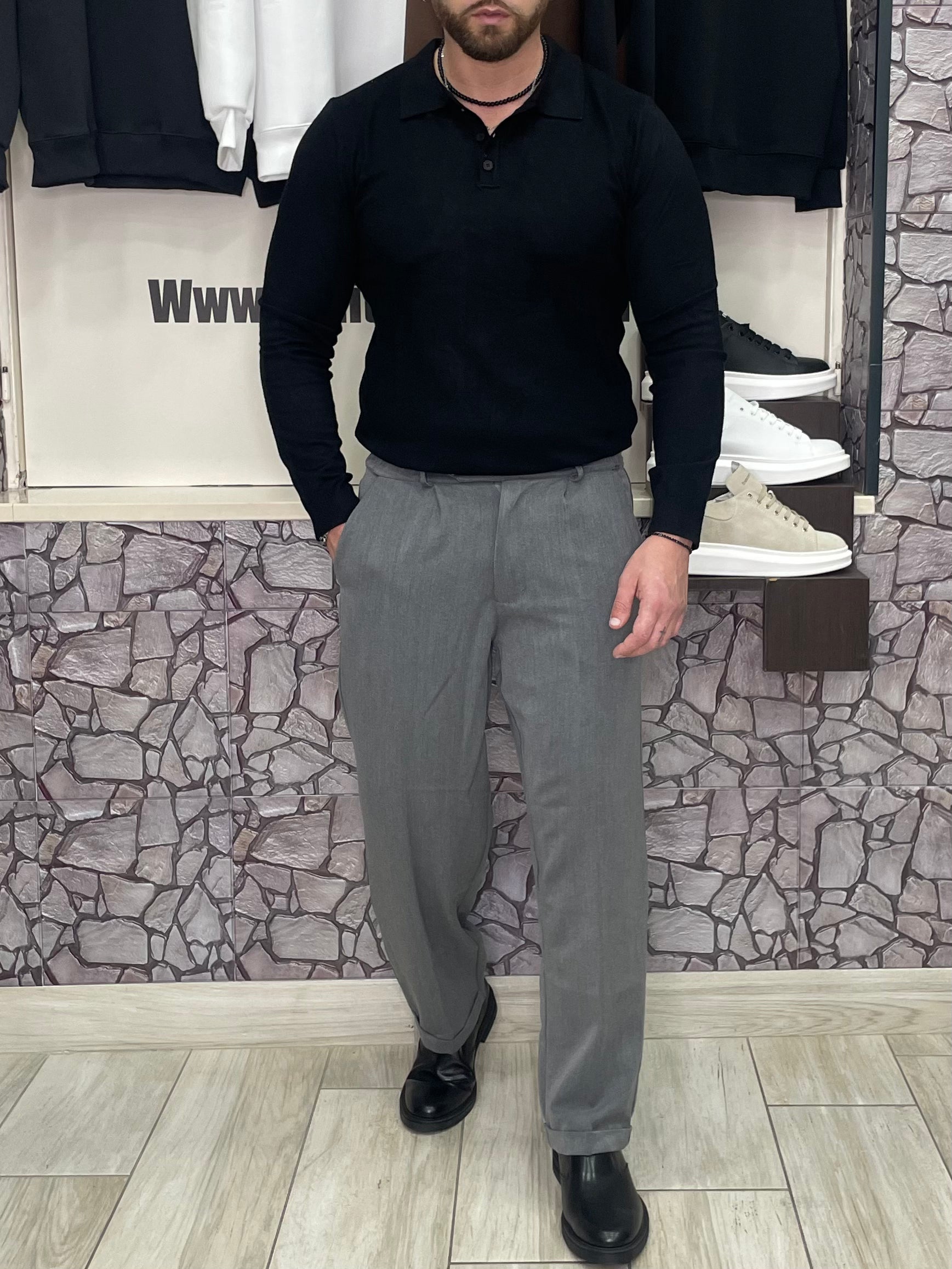 Polo con bottoni in lana pettinata